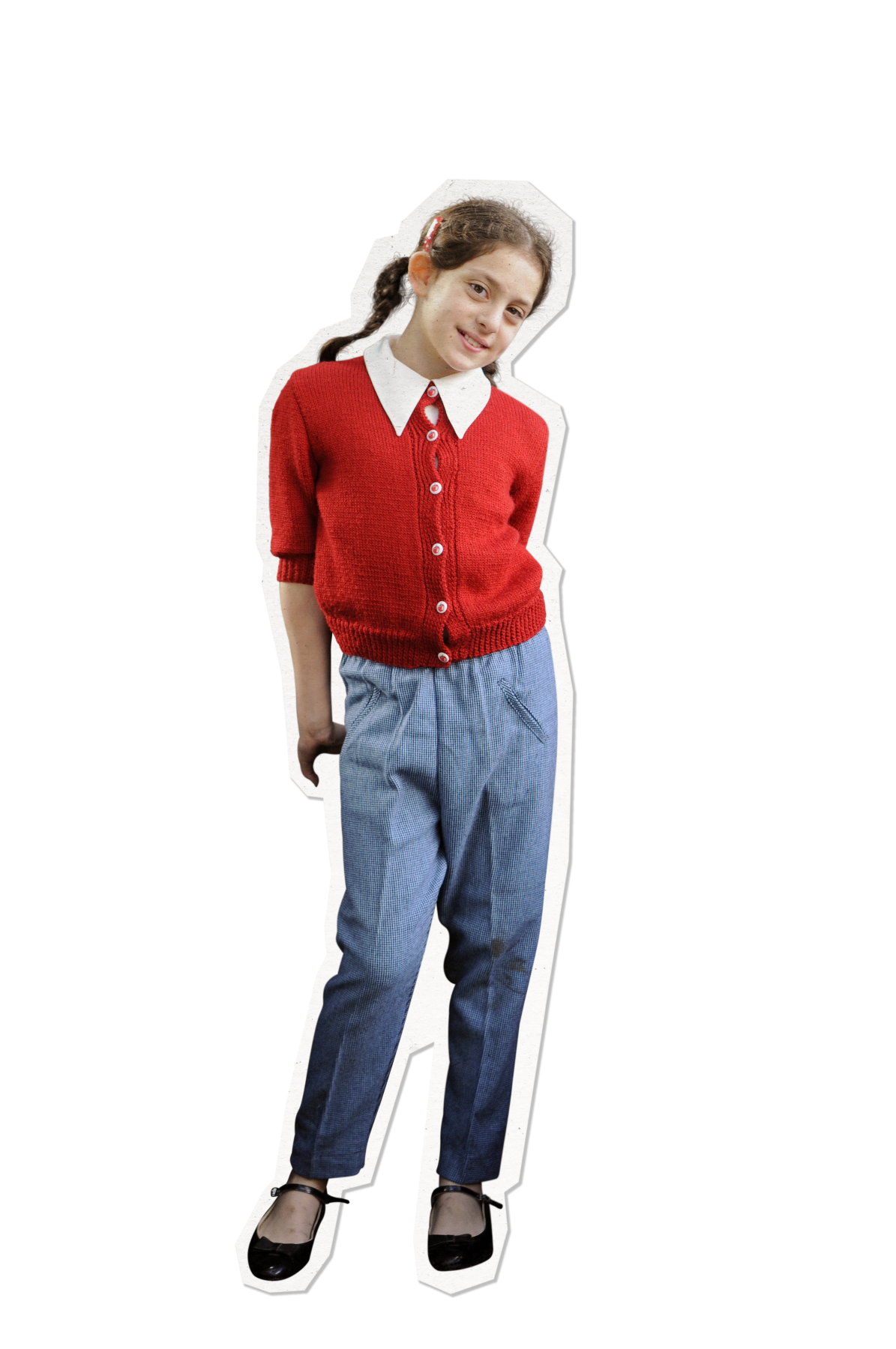 1968_Sofia_2 A young girl stands with a playful smile, wearing a red knitted cardigan over a white collared shirt and grey checkered trousers. She has her hair tied back and wears classic black shoes.