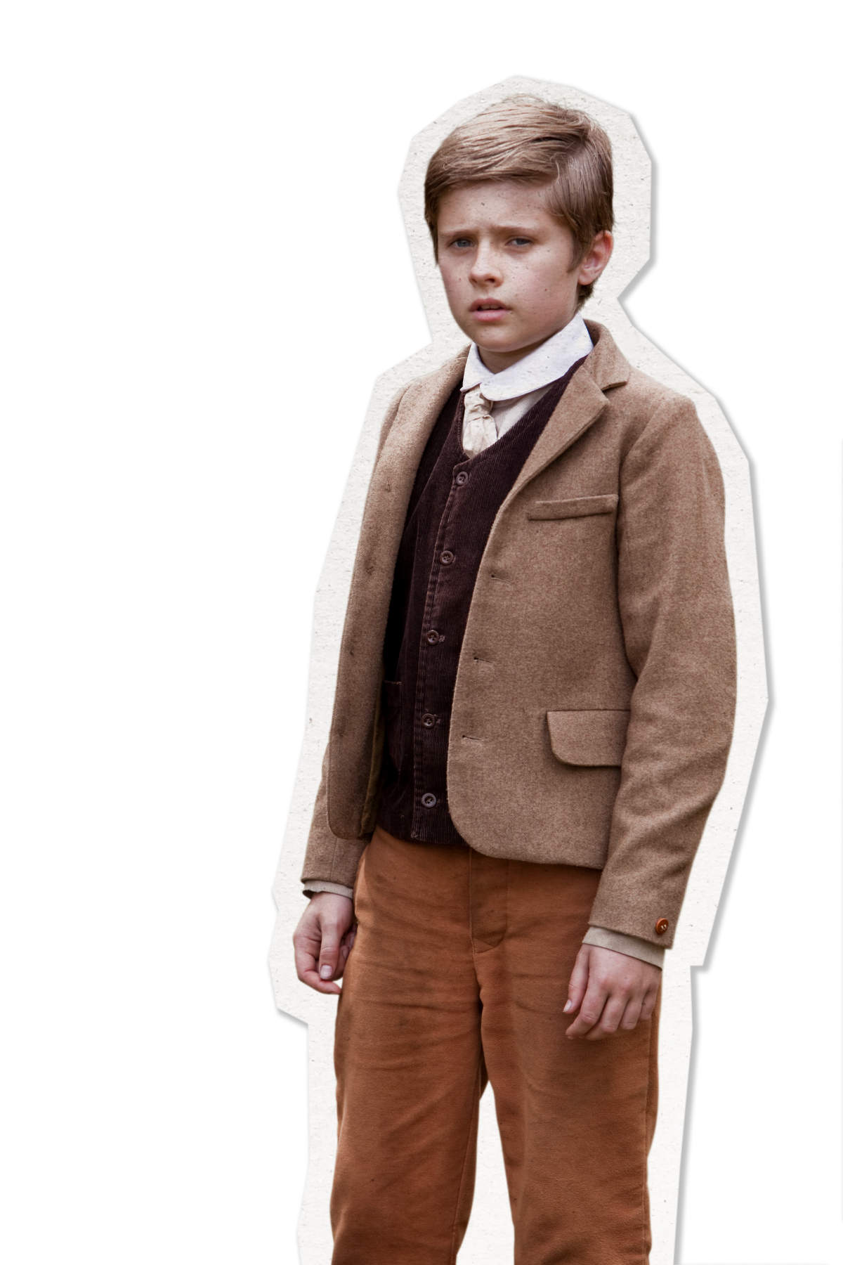 A young boy stands with a serious expression, wearing a light brown blazer over a dark vest and a white collared shirt. He has brown hair and is dressed in brown pants, with one hand resting on his hip and the other slightly forward, conveying a sense of uncertainty or concern. The background is plain black, emphasizing his figure.