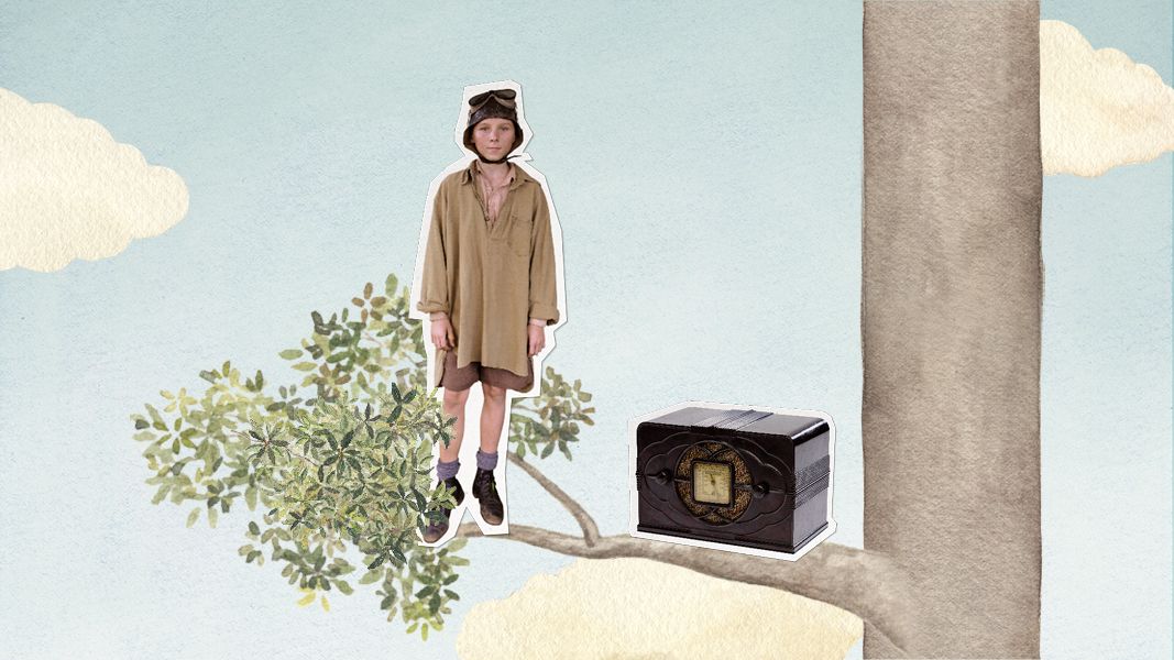 A young person dressed in a large, loose shirt and shorts stands on a branch of a tree, wearing goggles. Next to them sits an old-fashioned black and silver radio. The background features a blue sky with a few fluffy clouds.